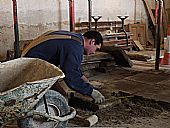 George re-laying flagstones, East Church, Cromarty